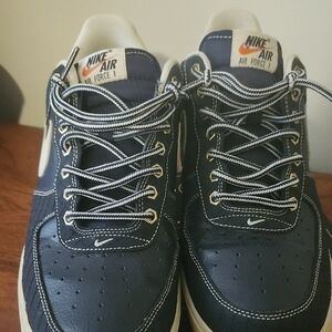 Nike Blue Sneakers with White Stitching and Low-Top Design